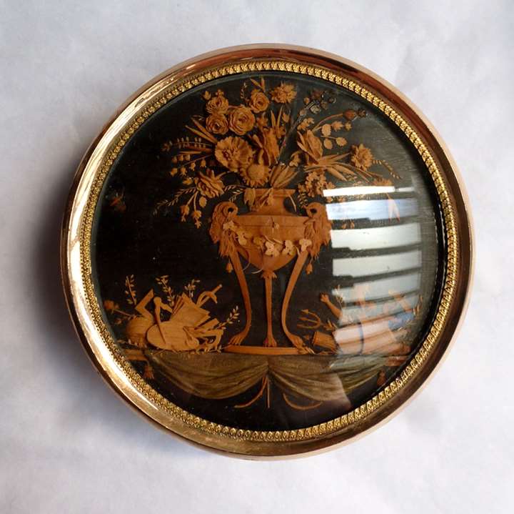A North Italian Circular Tortoiseshell and Gold Mounted Snuff box with a wood micro-carving
